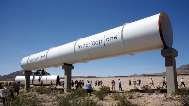 journalists-and-guests-look-over-tubes-following-a-propulsion-open-air-test-at-hyperloop-one-in-north-las-vegas_5595949.jpg